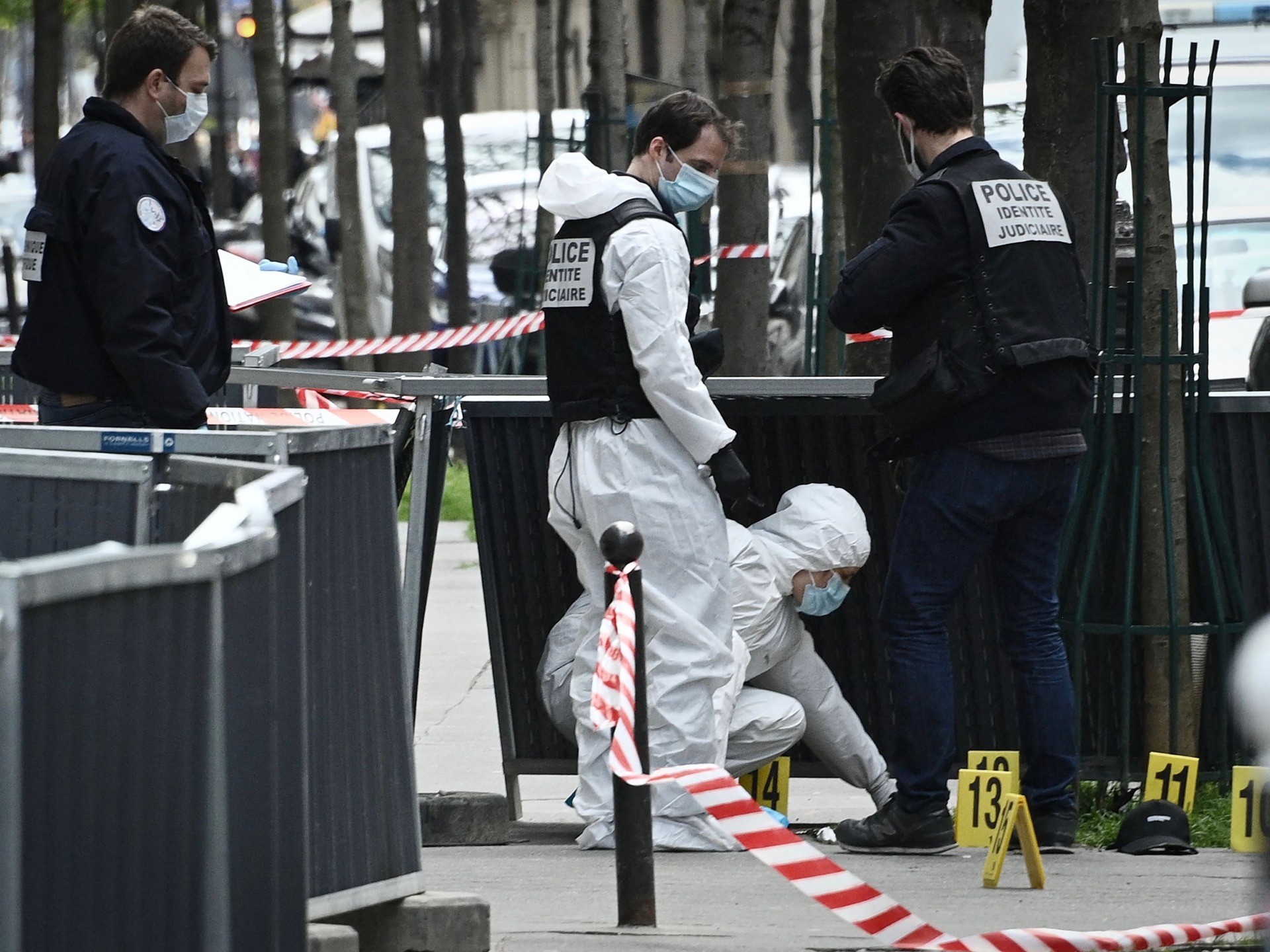 French police forensic investigators search for evidence near the Henry Dunant private hospital where one person was shot dead and one injured in a shooting outside the instituion owned by the Red Cross in Paris' upmarket 16th district on April 12, 2021. (Photo by Anne-Christine POUJOULAT / AFP) (Photo by ANNE-CHRISTINE POUJOULAT/AFP via Getty Images)
