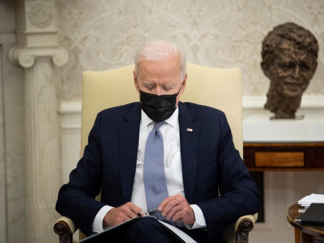 US President Joe Biden waits to speak in the Oval Office of the White House before a meeti