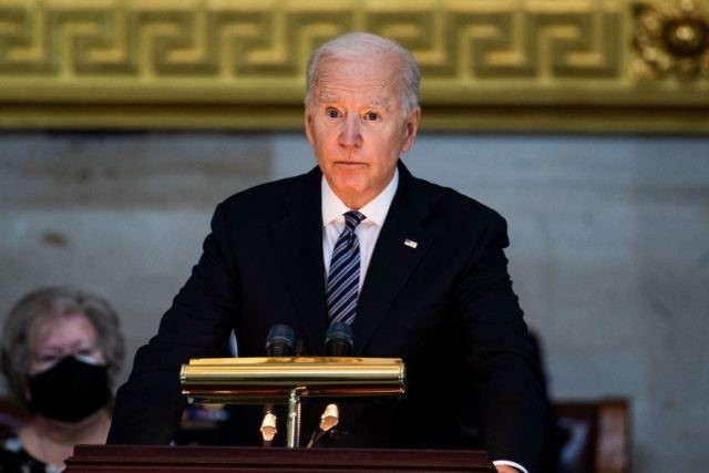President Joe Biden speaks during a ceremony to honor slain US Capitol Police officer William Billy Evans as he lies in honor at the Capitol in Washington, DC on April 13, 2021. - Evans was killed and another wounded after a man rammed through security and crashed into a barrier …