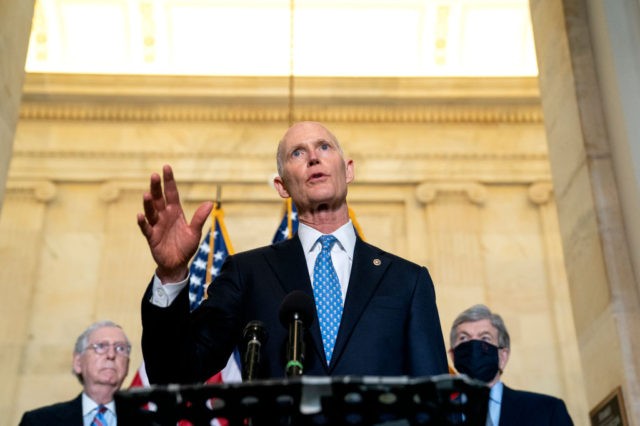 WASHINGTON, DC - APRIL 13: Senator Rick Scott (R-FL) speaks to reporters following Senate Republican Policy luncheons at the Russell Senate Office Building on Capitol Hill on April 13, 2021 in Washington, DC. Senate Republicans criticized U.S. President Joe Bidens plan to remove all troops from Afghanistan by September 11, …