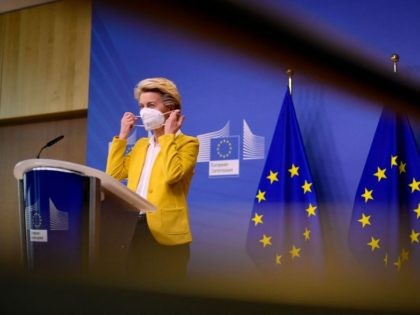 European Commission President Ursula von der Leyen removes her face mask as she arrives for a statement after a college meeting at the EU headquarters in Brussels on April 14, 2021. (Photo by JOHN THYS / POOL / AFP) (Photo by JOHN THYS/POOL/AFP via Getty Images)
