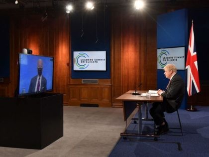 Host US President Joe Biden (screen) is seen on the screen as Britain's Prime Minister Boris Johnson takes part in the opening session of the virtual US Leaders Summit on Climate in the Downing Street Briefing Room in central London on April 22, 2021. (Photo by JUSTIN TALLIS / POOL …