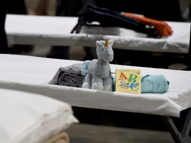 LONG BEACH, CA - APRIL 22: Sleeping quarters set up inside Exhibit Hall B for migrant children are shown during a tour of the Long Beach Convention Center on April 22, 2021 in in Long Beach, California. Long Beach officials and officials with the U.S. Department of Health and Human …