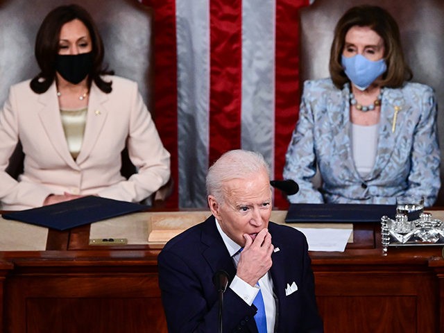 WASHINGTON, DC - APRIL 28: U.S. President Joe Biden addresses a joint session of congress as Vice President Kamala Harris (L) and Speaker of the House U.S. Rep. Nancy Pelosi (D-CA) (R) look on in the House chamber of the U.S. Capitol on April 28, 2021 in Washington, DC. On …
