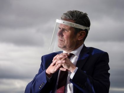 NOTTINGHAM, ENGLAND - JULY 16: Labour Party leader, Sir Keir Starmer, wears a face visor during talks with care home workers and family members of residents during a visit to Cafe 1899 in Gedling Country Park on July 16, 2020 in Nottingham, England. The opposition leader discussed the impact of …