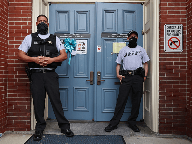 Sheriff Deputies stand in front of the front entrance to the Pasquotank County Courthouse