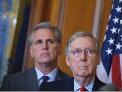 Senate Majority Leader Mitch McConnell (R), R-KY, stands next to House Majority Leader Kev