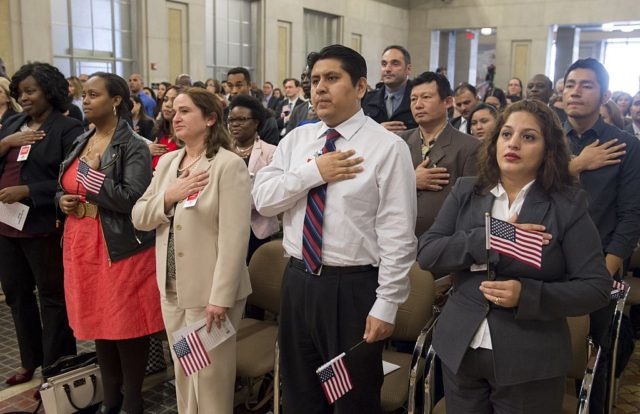 Candidates for US citizenship take the oath of allegiance to become US citizens during a N