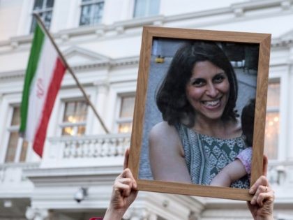 LONDON, ENGLAND - JANUARY 16: Supporters hold a photo of Nazanin Zaghari-Ratcliffe during a vigil for British-Iranian mother, Nazanin Zaghari-Ratcliffe, imprisoned in Tehran outisde the Iranian Embassy on January 16, 2017 in London, England. Charity worker Nazanin Zaghari-Ratcliffe was jailed for five years in September 2016 for allegedly attempting to …