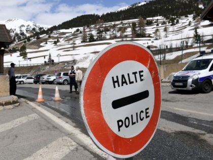 A picture taken on April 23, 2018 shows a sign board reading "Stop Police" at the French checkpoint of French Border Police in Montgenevre on the border between France and Italy in the Alps. - France's interior minister said, on April 22, 2018, he would send "significant" security reinforcements to …