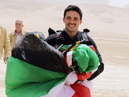 Jordanian Prince Hamza bin al-Hussein, president of the Royal Aero Sports Club of Jordan, carries a parachute during a media event to announce the launch of "Skydive Jordan", in the Wadi Rum desert on April 19, 2011. Skydive Jordan will be held June 8th till June 30th in Wadi Rum. …