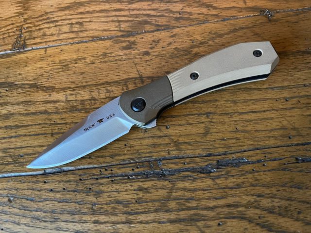 The Buck Knives 590 Paradigm is an assisted spring flip knife with G10 handles and a locki