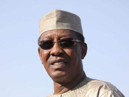 Chad's president Idriss Deby welcomes France's president upon his arrival at the internati