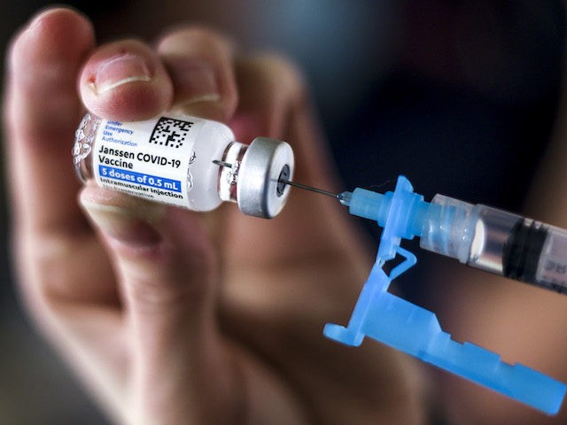 THORNTON, CO - MARCH 06: Adams 12 Five Star Schools District RN Tiffany Karschamroon draws a dose from a vial of the Johnson & Johnson COVID-19 vaccine, the newest vaccine approved by the U.S. FDA for emergency use, at an event put on by the Thornton Fire Department on March …