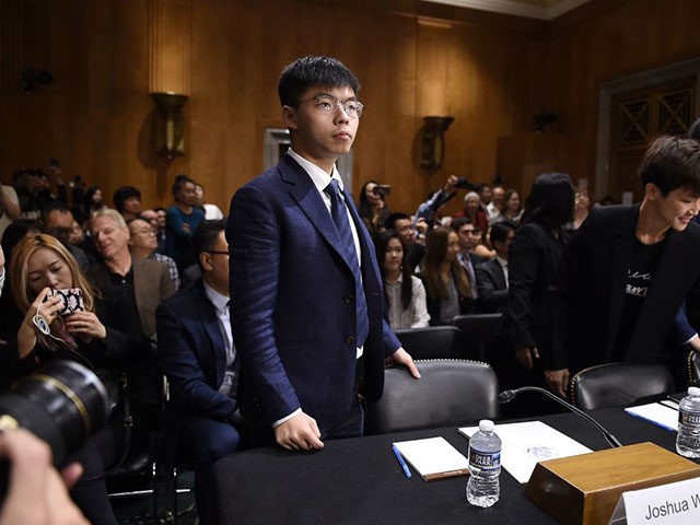 TOPSHOT - Joshua Wong, secretary-general of Hong Kong's Demosisto party and leader of the "Umbrella Movement" arrives to testify before the Congressional-Executive Commission on China about the pro-democracy movement in Hong Kong, on September 17, 2019 on Capitol Hill in Washington, DC. (Photo by Olivier Douliery / AFP) (Photo by …