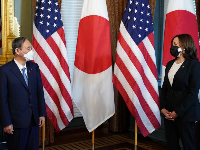 US Vice President Kamala Harris (R) hosts Japanese Prime Minister Yoshihide Suga ahead of a bilateral meeting in the Ceremonial Office at the Eisenhower Executive Office Building, next to the White House in Washington, DC, on April 16, 2021. (Photo by MANDEL NGAN / AFP) (Photo by MANDEL NGAN/AFP via …
