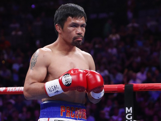 In this Saturday, July 20, 2019 file photo, Manny Pacquiao prepares to fight Keith Thurman in a welterweight title fight in Las Vegas. Qatar is preparing to host the 2022 World Cup and is now looking to attract big-name boxing. Promoter Bob Arum has been in talks with Qatari officials about bringing a welterweight unification bout between Manny Pacquiao and Terence Crawford to the energy-rich Gulf nation. (AP Photo/John Locher, File)