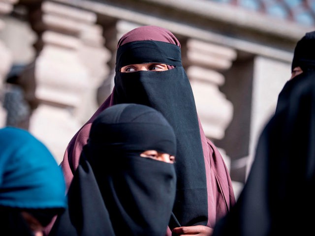 Women wearing niqab exit the Danish Parliament in Copenhagen, Denmark, on May 31, 2018. - The Danish parliament on Thursday, May 31,2018, passed a law banning the Islamic full-face veil in public spaces, becoming the latest European country to do so. (Photo by Mads Claus Rasmussen / Ritzau Scanpix / …