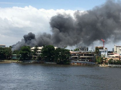 TOPSHOT - A general view of smoke arising from the Ikoyi prison that is on fire in Lagos o