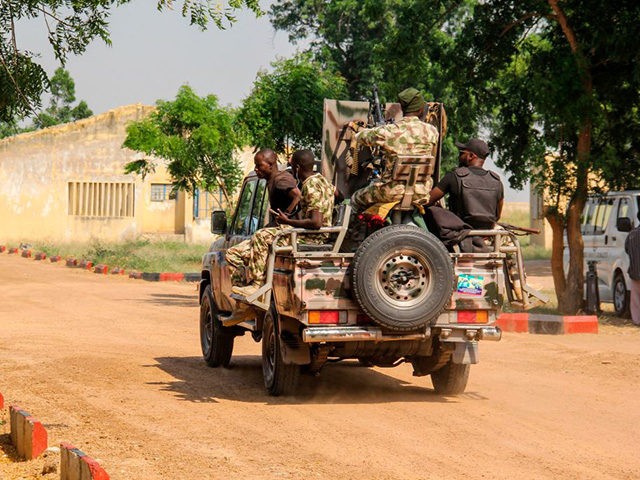 Nigerian Army soldiers are seen driving on a military vehicle in Ngamdu, Nigeria, on November 3, 2020. (Photo by Audu Marte / AFP) (Photo by AUDU MARTE/AFP via Getty Images)
