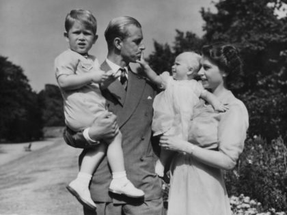 FILE - In this Aug. 1951 file photo, Britain's Queen Elizabeth II, then Princess Elizabeth, stands with her husband Prince Philip, the Duke of Edinburgh, and their children Prince Charles and Princess Anne at Clarence House, the royal couple's London residence. Prince Philip was born into the Greek royal family …