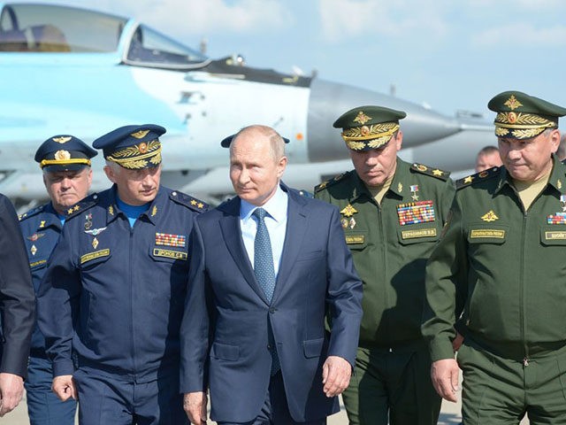 TOPSHOT - Russian President Vladimir Putin, surrounded by top military officers and officials, tours a military flight test centre in Akhtubinsk on May 14, 2019. (Photo by Alexey NIKOLSKY / SPUTNIK / AFP) (Photo credit should read ALEXEY NIKOLSKY/AFP via Getty Images)