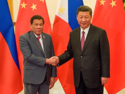 Chinese President Xi Jinping (R) shakes hands with Philippines President Rodrigo Duterte (L) prior to their bilateral meeting during the Belt and Road Forum for International Cooperation at the Great Hall of the People on May 15, 2017 in Beijing, China. (Etienne Oliveau/Pool/Getty Images)
