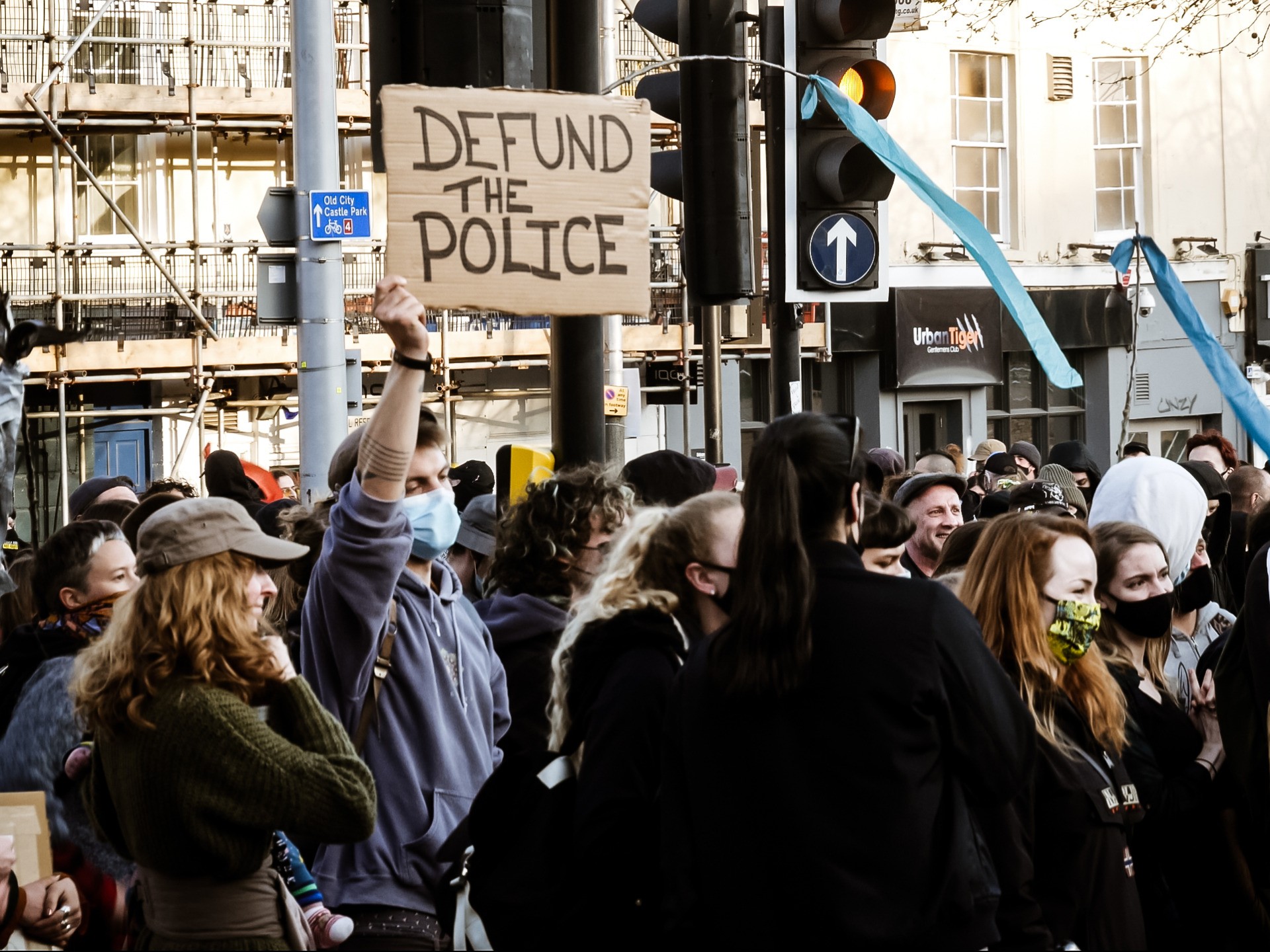 A protester holds up a 'defund the police' placard during a #KillTheBill protest on Saturday, April 3, 2020. Kurt Zindulka, Breitbart News