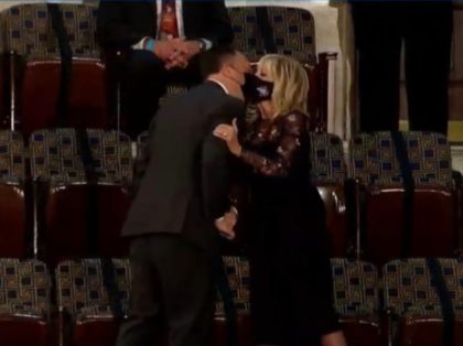 First Lady Jill Biden and Second Gentleman Doug Emhoff kiss through their masks at President Joe Biden's first joint session to Congress. Screenshot via The White House/YouTube.