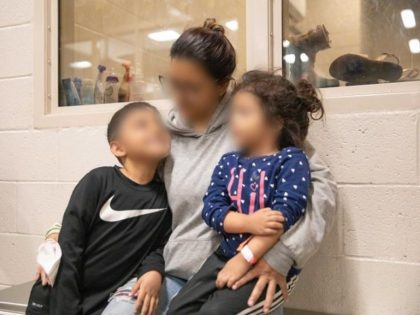Venezuelan family apprehended after being lowered by human smugglers from 30' border wall. (Photo: U.S. Border Patrol/El Centro Sector)