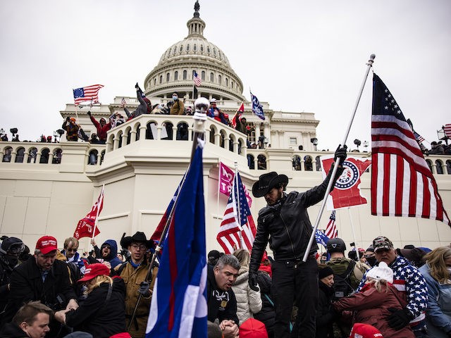 Pro-Trump supporters storm the US Capitol following a rally with President Donald Trump on January 6, 2021 in Washington, DC. Trump supporters gathered in the nation's capital today to protest the ratification of President-elect Joe Biden's Electoral College victory over President Trump in the 2020 election. (Photo by Samuel Corum/Getty …