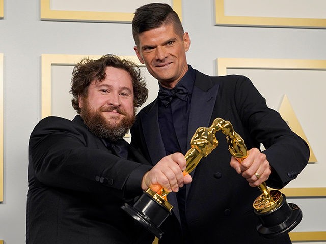 Michael Govier, left, and Will McCormack pose in the press room with the award for best animated short film for “If Anything Happens I Love You at the Oscars on Sunday, April 25, 2021, at Union Station in Los Angeles. (AP Photo/Chris Pizzello, Pool)