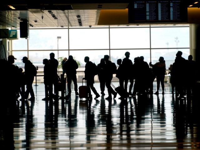 Travelers walk through the Salt Lake City International Airport Wednesday, March 17, 2021, in Salt Lake City. Airlines and others in the travel industry are throwing their support behind vaccine passports to boost pandemic-depressed travel, and authorities in Europe could embrace the idea quickly enough for the peak summer vacation …
