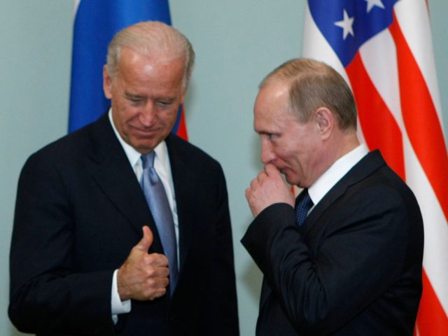 Vice President of the United States Joe Biden, left, geatures as he meets Russian Prime Minister Vladimir Putin in Moscow, Russia, Thursday, March 10, 2011.The talks in Moscow are expected to focus on missile defense cooperation and Russia's efforts to join the World Trade Organization. (AP Photo/Alexander Zemlianichenko)
