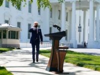 Biden Wears Masks Outside, Alone, to Model How to "Take It Off"