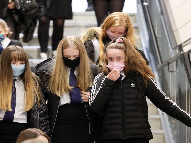 GLASGOW, SCOTLAND - AUGUST 31: Pupils at Rosshall Academy wear face coverings as it becomes mandatory in corridors and communal areas on August 31, 2020 in Glasgow, Scotland. New rules starting today require children over 12 to wear face coverings in corridors and other communal areas in schools in Scotland. …