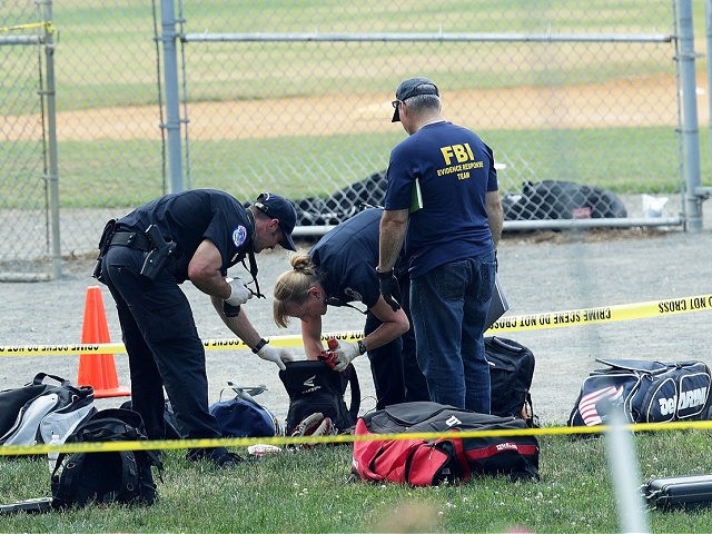 ALEXANDRIA, VA - JUNE 14: Investigators search the bags that have been left behind at the Eugene Simpson Stadium Park where a shooting had happened June 14, 2017 in Alexandria, Virginia. U.S. House Majority Whip Rep. Steve Scalise (R-LA) and multiple congressional aides were shot by a gunman during a …