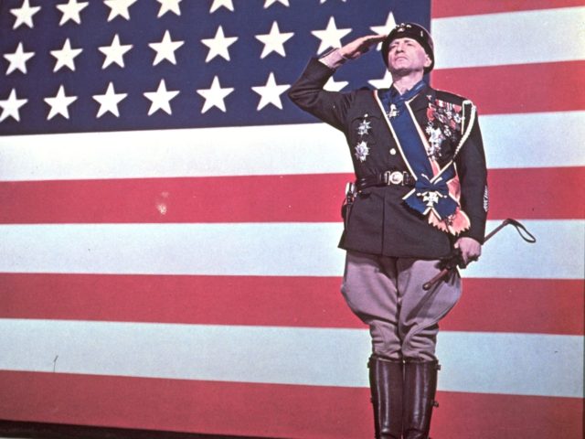 Promotional portrait of American actor George C. Scott (1927- 1999) saluting before an American flag for the film 'Patton,' directed by Franklin Schaffner (1920 - 1989), 1970. (Photo by 20th Century Fox/Courtesy of Getty Images)