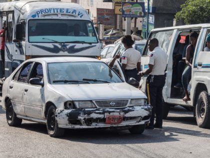 Police officers stop a car in a street of Port-au-Prince on April 12, 2021. (Photo by Valerie Baeriswyl / AFP) (Photo by VALERIE BAERISWYL/AFP via Getty Images)