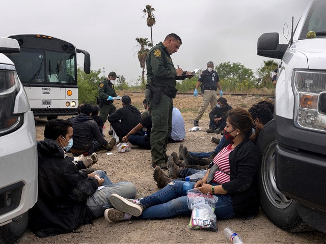LA JOYA, TEXAS - APRIL 13: A U.S. Border Patrol agent registers immigrants before bussing them to a processing center near the U.S.-Mexico border on April 13, 2021 in La Joya, Texas. A surge of immigrants making the arduous journey from Central America to the United States has challenged U.S. immigration agencies along the southern border. (Photo by John Moore/Getty Images)