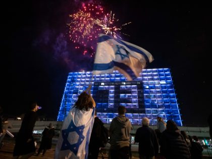 Israelis watch a fireworks show during Israel's Independence Day celebrations after more t