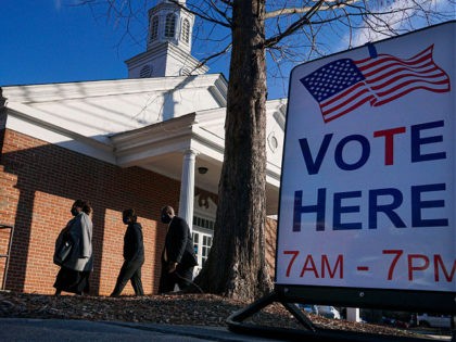 Voters enter a polling station at the Zion Baptist Church on January 5, 2021 in Marietta, Georgia. - After an unprecedented campaign that mobilized President Donald Trump and his successor Joe Biden, the people of Georgia started voting Tuesday in two US Senate runoffs that could shape the first years …