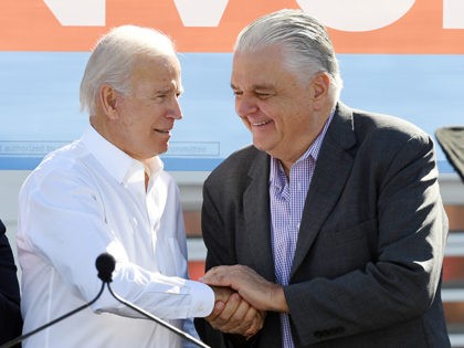 LAS VEGAS, NEVADA - OCTOBER 20: Former U.S. Vice President Joe Biden (L) greets Clark Coun