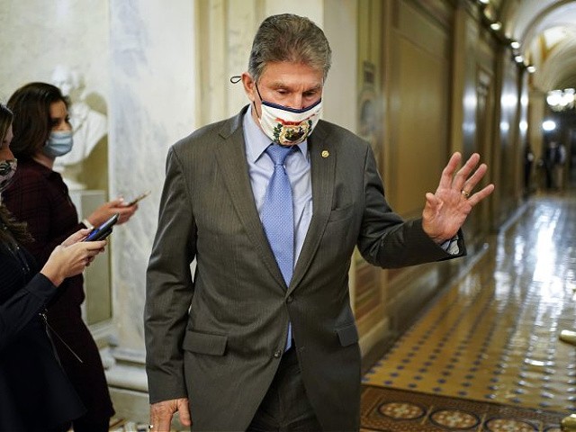 WASHINGTON, DC - FEBRUARY 10: Sen. Joe Manchin (D-WV) departs after the day's proceedings in the impeachment trial of former President Donald Trump at the U.S. Capitol on February 10, 2021 in Washington, DC. House impeachment managers will make the case that Trump was responsible for the January 6th attack at the U.S. Capitol and he should be convicted and barred from holding public office again. (Photo by Joshua Roberts-Pool/Getty Images)