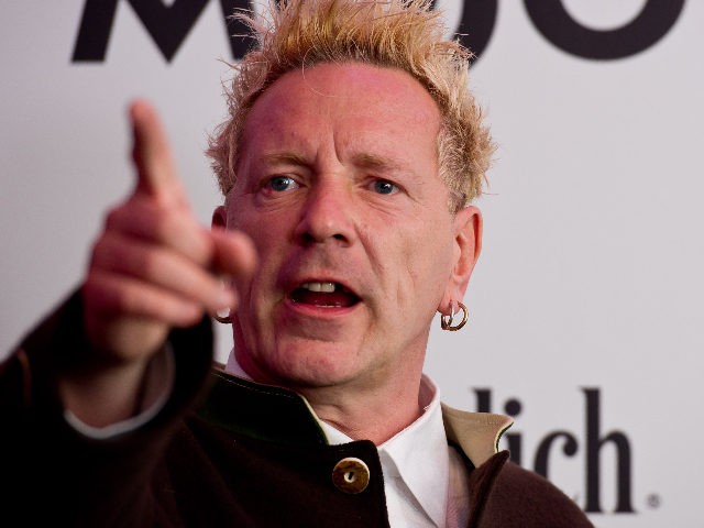 LONDON, ENGLAND - JULY 21: John Lydon poses in front of the winners boards after accepting the Outstanding Contribution to Music Award for PiLat the Glenfiddich Mojo Honours List 2011 at The Brewery on July 21, 2011 in London, England. (Photo by Ian Gavan/Getty Images)