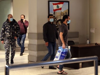 Lebanese citizens held in custody in the United Arab Emirates arrive at Lebanon's Rafiq Hariri International Airport in Beirut on February 2, 2021 after a deal was reached to secure their release. - A deal has been struck with the United Arab Emirates to release from custody 11 Lebanese citizens. …