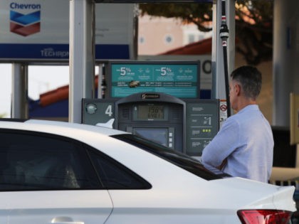A customer pumps gas into a vehicle as reports indicate that the price of gasoline continues to rise on April 9, 2018 in Miami, Florida. AAA forecasts the national gas price average will be as much as $2.70/gallon this spring and summer. (Photo by Joe Raedle/Getty Images)