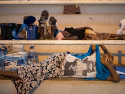 TOPSHOT - An internally displaced woman (IDP) from Palma sleeps at the Pemba Sports center in Pemba on April 2, 2021. - People were evacuated from the coasts of Palma after armed insurgents attacked the city on March 24, 2021. (Photo by Alfredo Zuniga / AFP) (Photo by ALFREDO ZUNIGA/AFP …