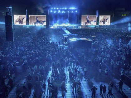 Fans watch the New Zealand band Six60 perform at Eden Park in Auckland, New Zealand, Satur