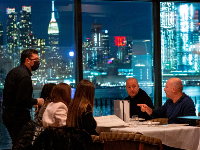 Customers dine at the Greek restaurant Molos in Weehawken, New Jersey on February 6, 2021, amid the coronavirus pandemic. - Restaurants across the state can expand their indoor capacity limits to 35%, up from the previous 25%. (Photo by Kena Betancur / AFP) (Photo by KENA BETANCUR/AFP via Getty Images)